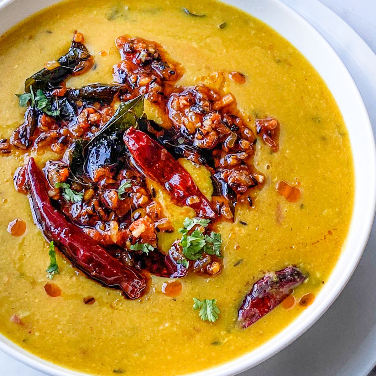 bowl of Dal Tadka with ghee and chili oil