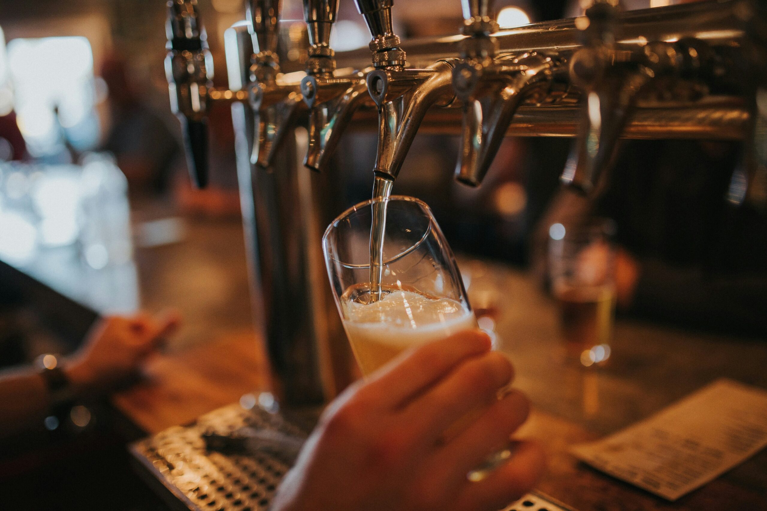 A pilsner lager being poured straight from the tap