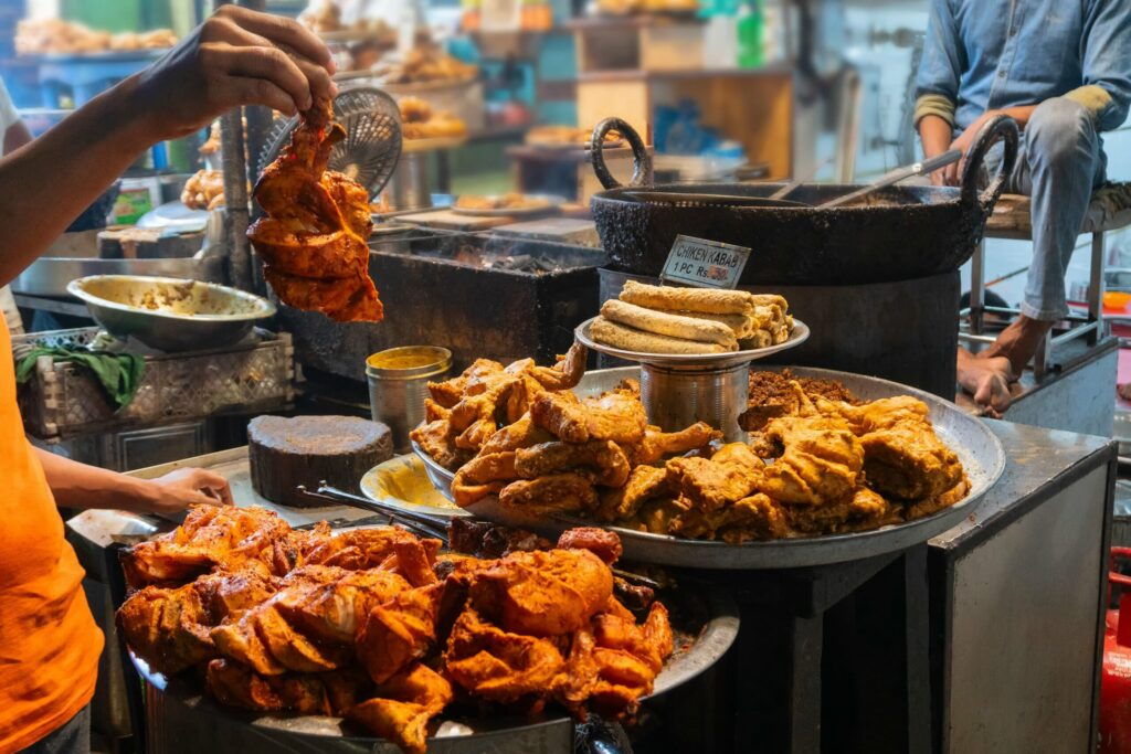 Busy Mumbai street‑food market at dusk