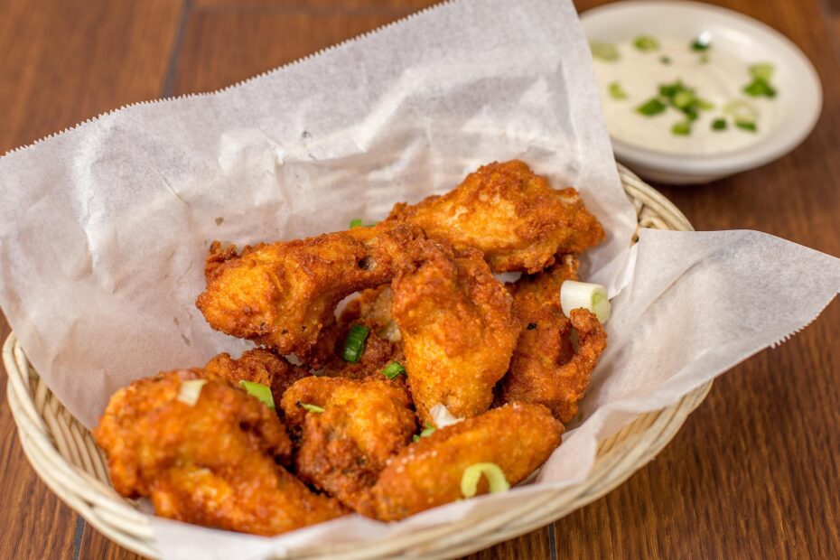 Spicy chicken wings paired with an India Pale Ale — bold hops balance heat in this craft beer pairing